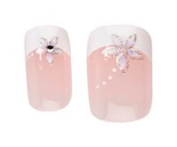 Pink Floral Nail Art Design Pink nail art with floral designs featuring white tips and embellishments, perfect for stylish manicures and nail care.
