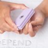 Supershine Depend lavender nail buffer held in hands, designed for smoothing and shaping nails, ideal for manicures and pedicures.
